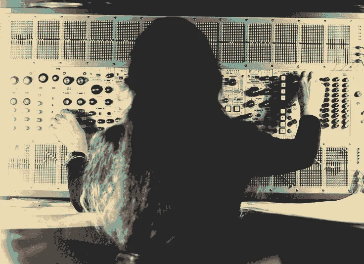 The composer Éliane Radigue manipulating an ARP synthesiser.